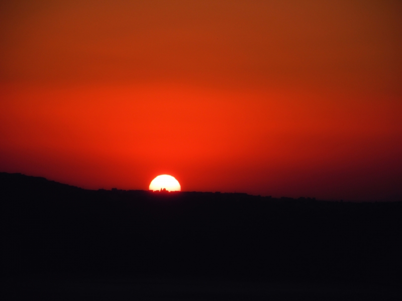 Santorini sunset over Thirassia