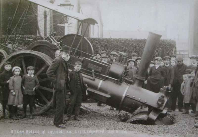 Postcard image of a steam roller crash