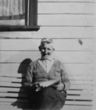 Old Alec McDonaldat his cottage by the showground