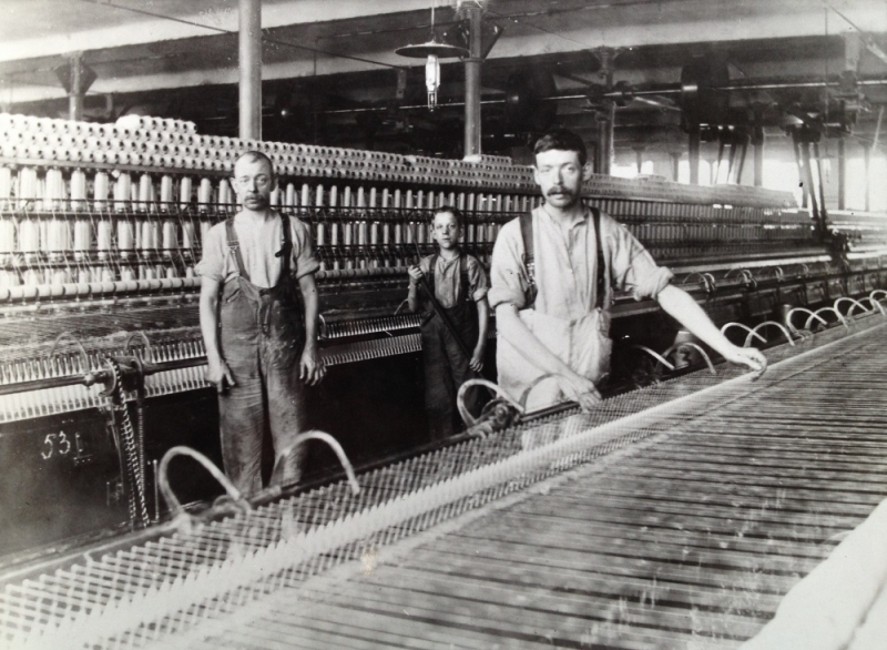 The Times Mill, Middleton, 1912, Left-Thomas Burrows, Minder, Centre-His son Thomas Jr, little piecer. The man on the right unknown.