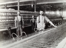The Times Mill, Middleton, 1912, Left-Thomas Burrows, Minder, Centre-His son Thomas Jr, little piecer. The man on the right unknown.